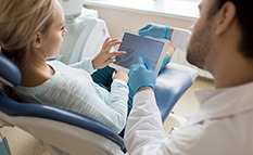 Woman talking to a dentist