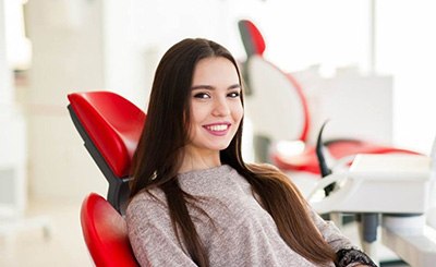 a patient smiling before undergoing dental care