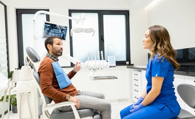 Patient and dental team member engaged in conversation