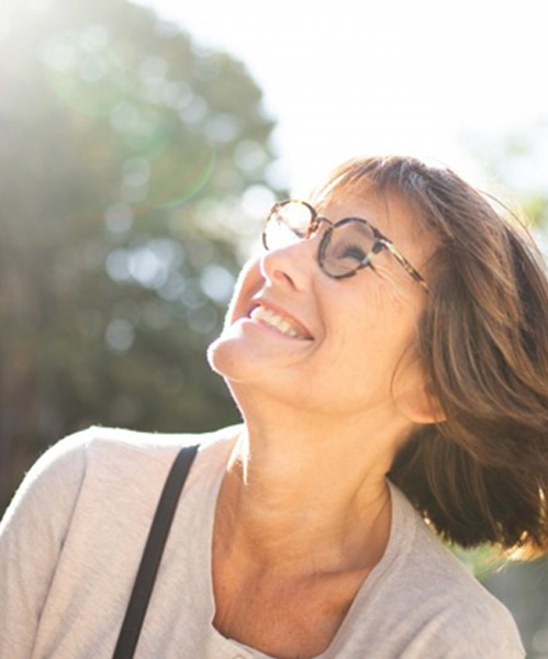 Lady smiles at the sun